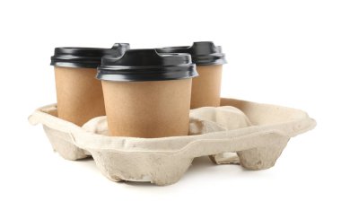 Paper coffee cups in cardboard holder isolated on white