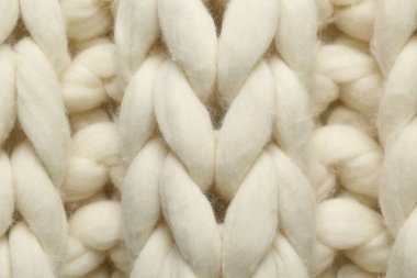 Arka plan olarak beyaz örülmüş yün dokusu, üst görünüm