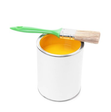 Can of yellow paint and brush isolated on white