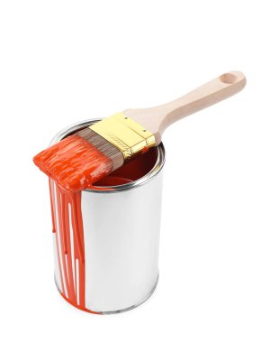 Can of orange paint and brush isolated on white