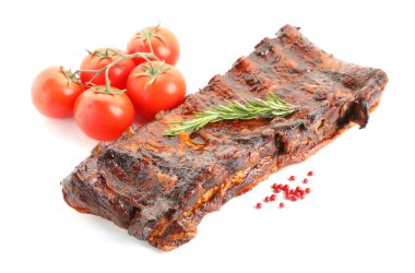 Lezzetli domuz pirzolası, domates, baharat ve biberiye.