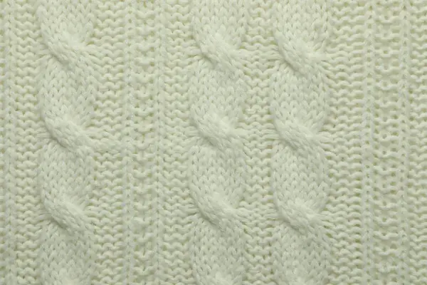 Arka plan olarak örülmüş beyaz yün kumaş, üst görünüm