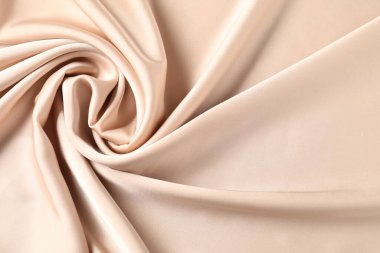 Arkaplan olarak bej buruşuk ipek kumaş, üst görünüm