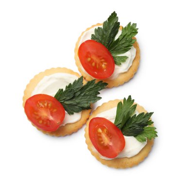 Krem peynirli, domatesli ve maydanozlu leziz krakerler.