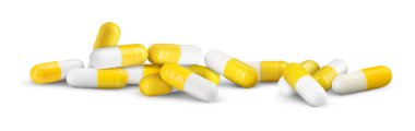 Antibiyotik hapları. Beyaz arkaplanda sarı ve beyaz kapsüller