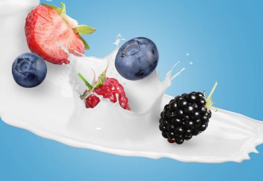 Süt sıçraması ve açık mavi arkaplanda farklı taze meyveler.