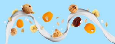 Yulaflı süt akışı ve açık mavi arka planda kurumuş meyveler. Pankart tasarımı