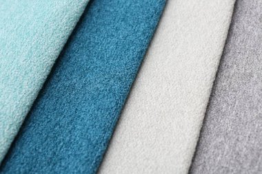 Arka plan olarak farklı kumaşlardan örnekler, yakın plan