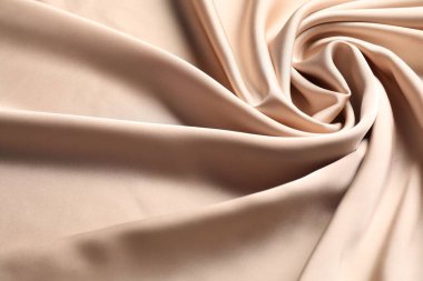 Arkaplan olarak bej buruşuk ipek kumaş, görünümün üzerinde