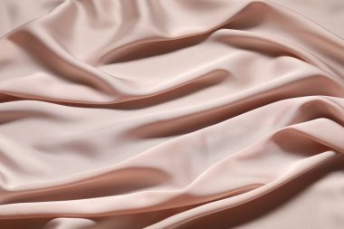 Pembe buruşuk ipek kumaş arka plan olarak, görünümün üzerinde