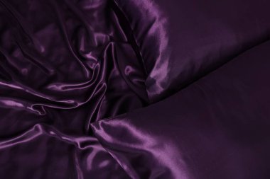 Lüks mor ipek çarşaflar arka plan olarak, üst görünüm