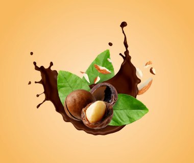 Koyu bej arka planda fındıklı çikolata sıçraması.