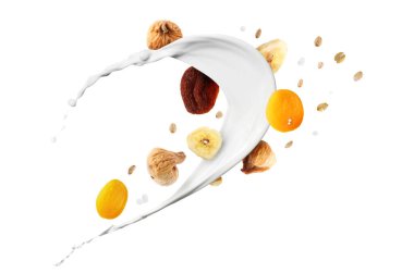 Süt, yulaf ezmesi ve beyaz arka planda kuru meyveler. Sağlıklı kahvaltı.