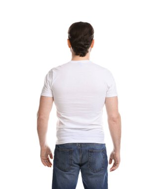 Man wearing blank t-shirt on white background, back view. Mockup for design