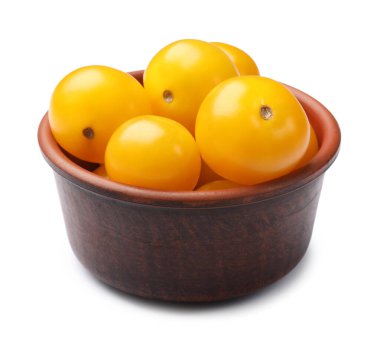 Beyaz tenceredeki olgun sarı domatesler.