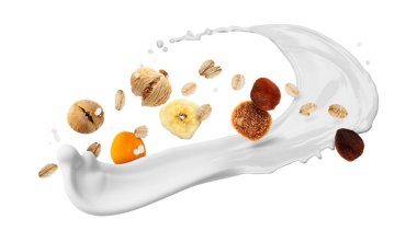 Süt, yulaf ezmesi ve beyaz arka planda kuru meyveler. Sağlıklı kahvaltı.