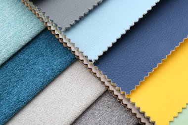 Arka plan olarak farklı kumaşlardan örnekler, yakın plan