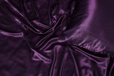 Lüks mor ipek çarşaflar arka plan olarak, üst görünüm