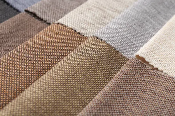 Arka plan olarak farklı kumaşlardan örnekler, yakın plan