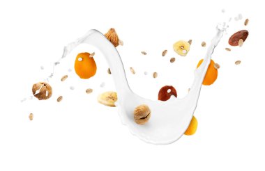 Süt, yulaf ezmesi ve beyaz arka planda kuru meyveler. Sağlıklı kahvaltı.