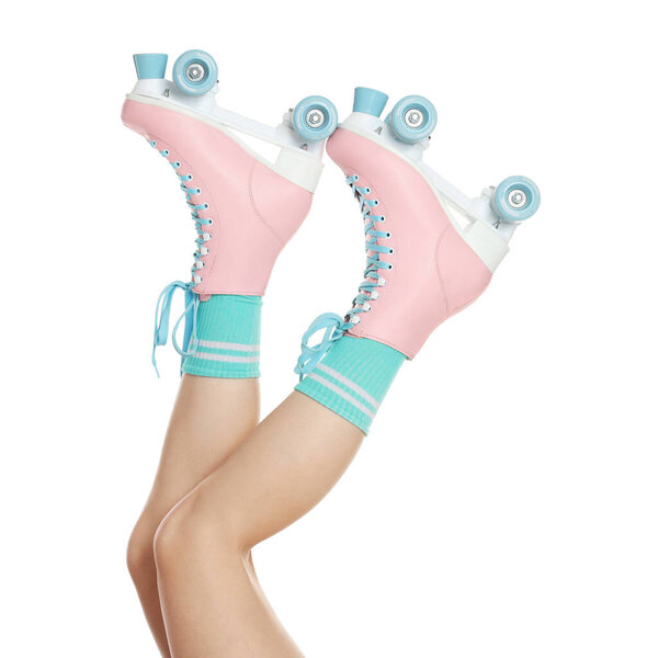 Woman in roller skates on white background, closeup