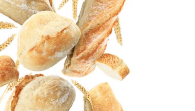 Taze ekmek ve dikenler beyaz arka plana düşüyor. Metin için alanı olan pankart tasarımı