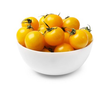 Beyaz tenceredeki taze sarı domatesler.