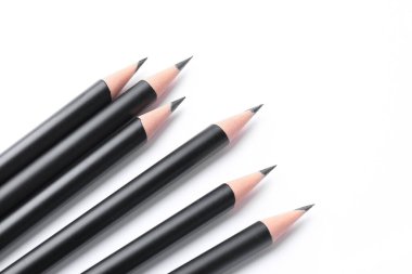 Many sharp graphite pencils isolated on white