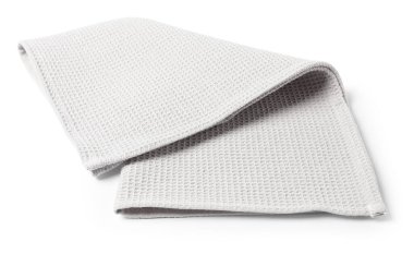 Temiz açık gri waffle havlusu beyaza izole edilmiş.