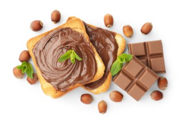 Toasts with tasty chocolate spread, pieces, mint and hazelnuts isolated on white, top view
