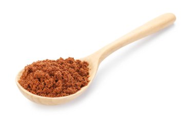 Tahta kaşıkta beyaz hindistan cevizi tozu.