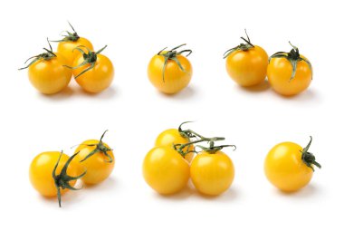 Beyaz arka planda taze sarı kiraz domatesleri, kolaj.
