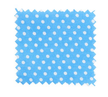 Üstten bakıldığında beyaz noktalı, açık mavi kumaş örneği.