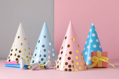 Parti şapkaları ve renk arkaplanındaki şenlik dekoru