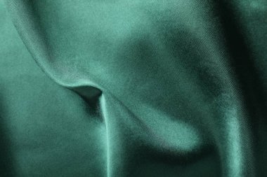 Arkaplan olarak buruşmuş yeşil ipek kumaş, üst görünüm