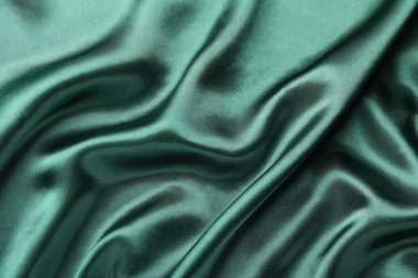 Arkaplan olarak buruşmuş yeşil ipek kumaş, üst görünüm