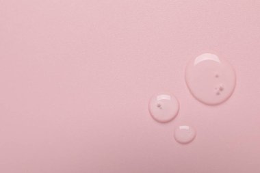 Pembe arka planda kolajen jel, üst manzara. Metin için boşluk