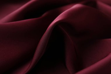 Buruşuk bordo ipek kumaş arka plan olarak, yakın plan