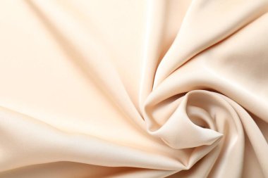 Arkaplan olarak buruşuk bej ipek kumaş, üst görünüm