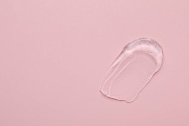 Pembe arka planda kolajen jel, üst manzara. Metin için boşluk