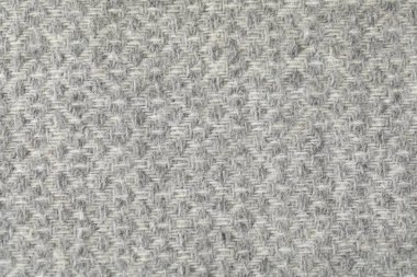 Arkaplan olarak açık gri yün kumaş dokusu, üst görünüm
