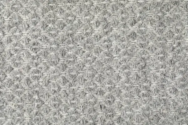 Arkaplan olarak açık gri yün kumaş dokusu, üst görünüm