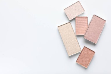 Beautiful eye shadow refill pans on white background, flat lay. Space for text