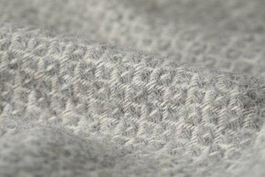 Arkaplan olarak açık gri yün kumaş dokusu, yakın plan