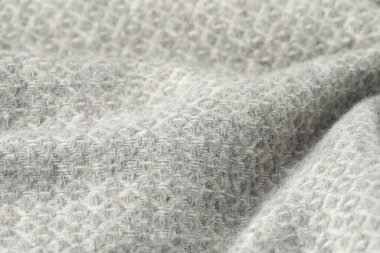 Arkaplan olarak açık gri yün kumaş dokusu, yakın plan