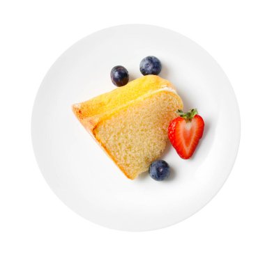 Lezzetli kek parçaları, beyaz böğürtlenli, üst manzara.