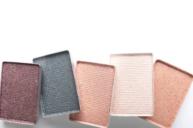 Beautiful eye shadow refill pans on white background, flat lay. Space for text