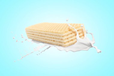 Lezzetli çıtır gofret ve açık mavi arka planda süt sıçraması.