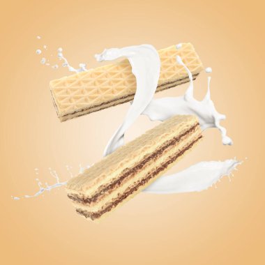 Lezzetli çıtır gofretler ve koyu bej arka planda süt sıçraması.