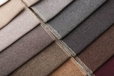 Arka plan olarak farklı kumaşlardan örnekler, yakın plan